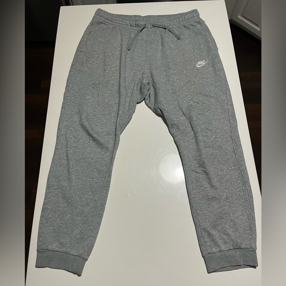 Nike Size Large Gray Joggers. Ultra-comfortable for lounging or outings.